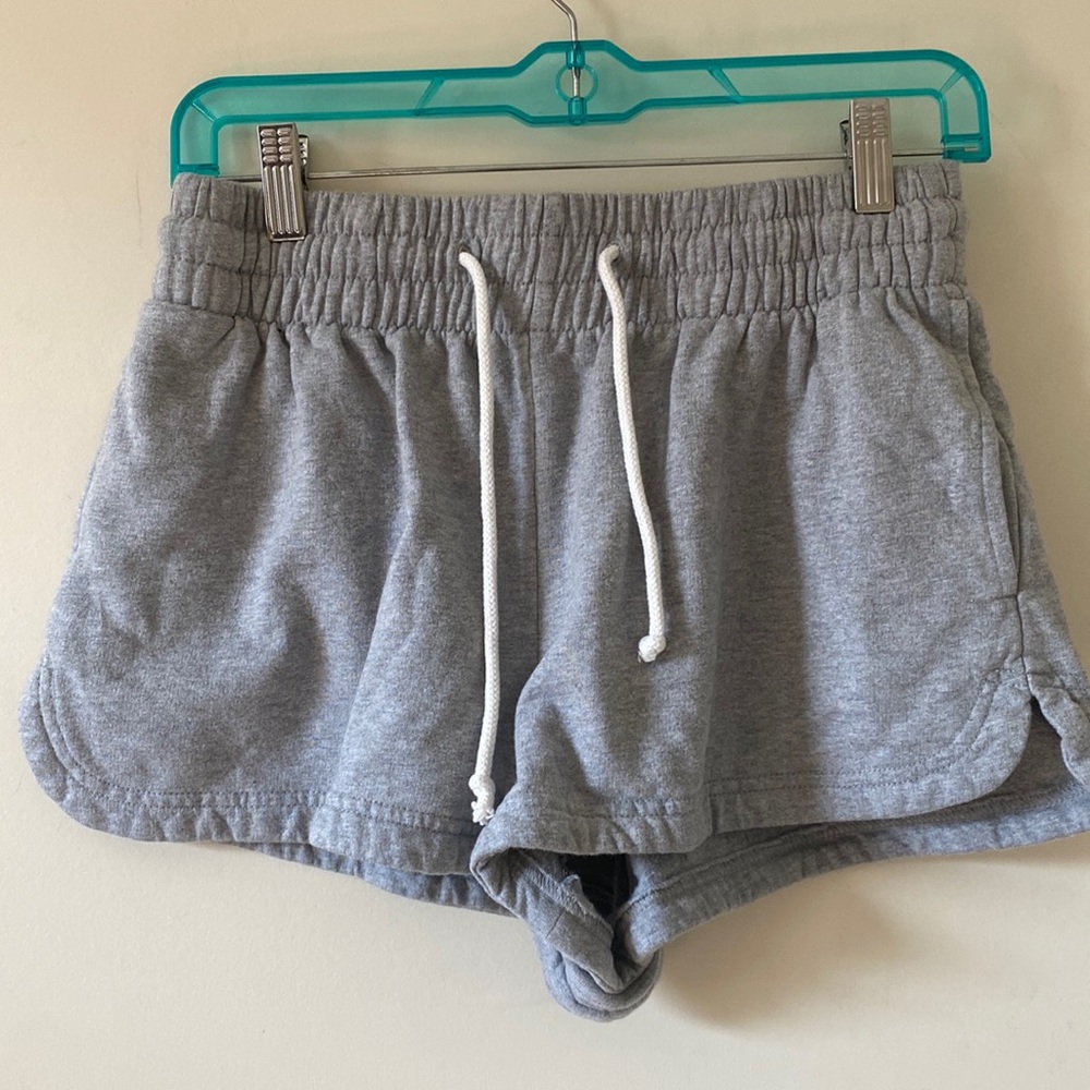 Out from under grey shorts